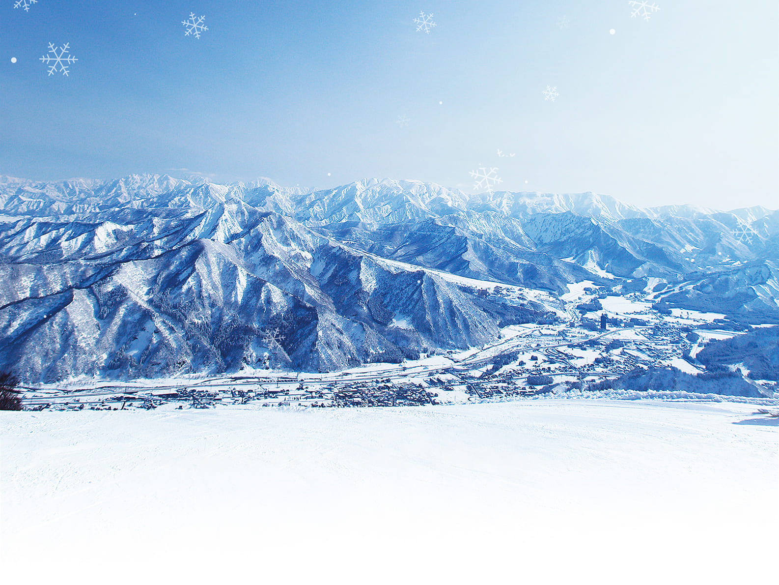 雪山でスキーを楽しむ人々の様子